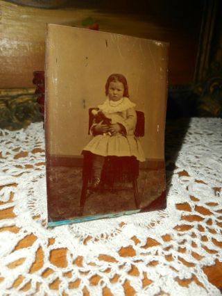 Antique Tintype Photo,  Sweet Girl,  Frown,  Holding Her Doll,  Chubby Cheeks