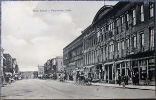 Painesville,  Oh 1910 Postcard: Main Street / Downtown W/overprinted Ad Text - Ohio