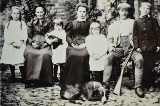 Charming 1890/1900s Cabinet Card Photo Family Group Shot Dog Shotgun Doll