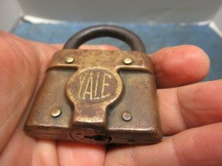 Odd shaped old brass padlock lock YALE.  Rare with the key.  n/r 2