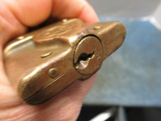 Odd shaped old brass padlock lock YALE.  Rare with the key.  n/r 4