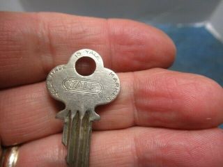 Odd shaped old brass padlock lock YALE.  Rare with the key.  n/r 5