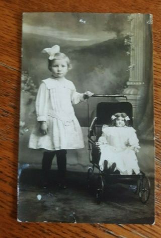 Antique Postcard Little Girl W Her Doll And Buggy Real Photo Dora Marie R_