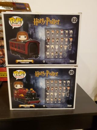 FUNKO POP RIDES HOGWARTS EXPRESS WITH HARRY POTTER & HERMIONE.  NM.  IN PROTECTORS 2
