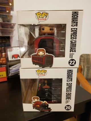 FUNKO POP RIDES HOGWARTS EXPRESS WITH HARRY POTTER & HERMIONE.  NM.  IN PROTECTORS 3