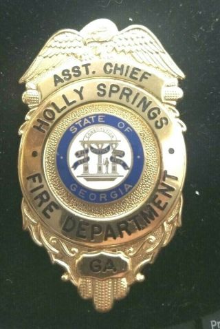 Obsolete Defunct Assistant Chief Holly Springs,  Ga Fire Dept.  Badge`blackington
