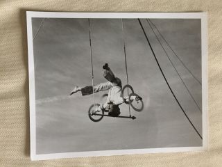 Vintage Circus Act Acrobat: Trapeze Artist Upside Down On The Swing Photo