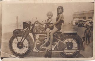 Egypt Old Vintage Photograph.  Cute Girls With An Old Motorcycle On The Beach