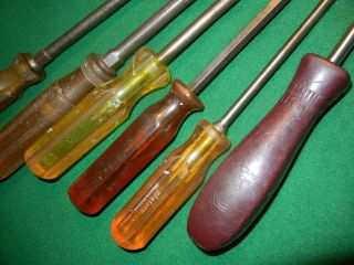 6 large flat head straight slot common screwdrivers - longest one is 17 inches 4