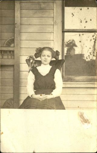 Rppc Pretty Young Woman Carved Chair On Porch Hair Ribbons Real Photo 1904 - 1918