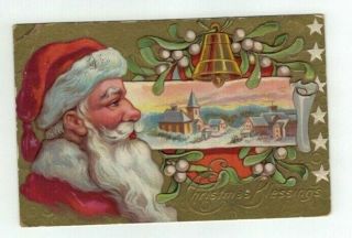 Antique Embossed Christmas Post Card Santa Face Gold Foil Mistletoe Bell Village