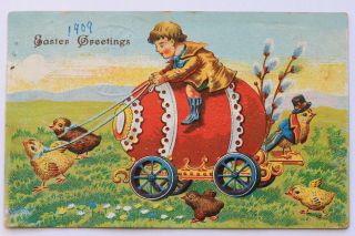 Old Embossed Postcard Easter Greetings Boy Riding Egg Carriage Pulled By Chicks,