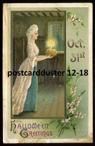 3310 - Halloween 1911 Embossed Woman With Pumpkin Candle By Winsch