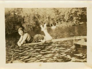 Vintage Snapshot - Girl Laying On A Diving Board In Her Swimsuit With Legs Up