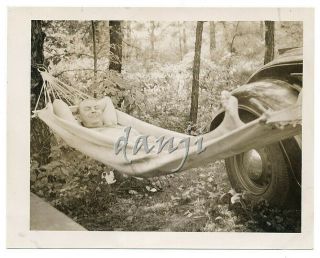 Cocky Man Lying In A Hammock By Car Tire With His Foot In The Camera Old Photo