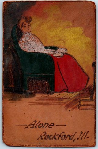 C1900s Rockford,  Illinois Leather Postcard " Alone " Girl In Chair Reading Book