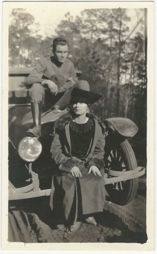 1920s Young Woman And American Soldier Sit On Hood Of Car Snapshot