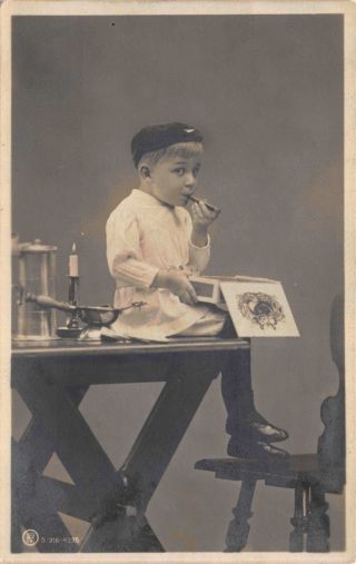 Real Photo Postcard Little Boy Smoking Cigar Sitting On Desk Photo Studio 114754