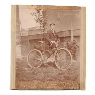 1880s Cabinet Card Sepiatone Photo Of Teen Wearing Newsboy Hat & Suit W/ Bicycle