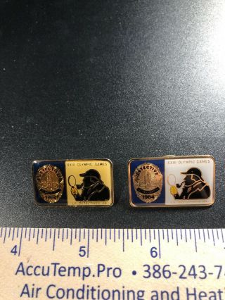 A56.  2 Olympic Pins,  23rd Games,  Sherlock Holmes & Los Angeles Police Dept.  1984
