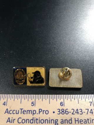 A56.  2 Olympic Pins,  23rd Games,  Sherlock Holmes & Los Angeles Police Dept.  1984 2