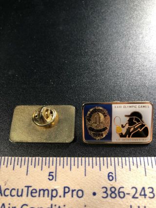 A56.  2 Olympic Pins,  23rd Games,  Sherlock Holmes & Los Angeles Police Dept.  1984 3