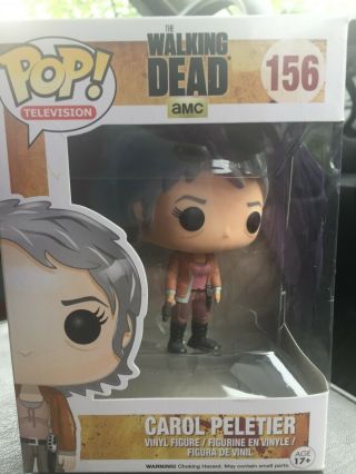 Carol Peletier From The Walking Dead And In Its Box