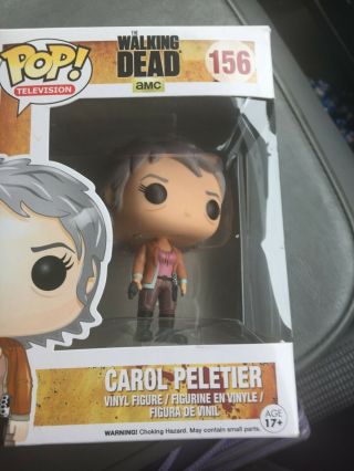 Carol Peletier from The Walking Dead and in its box 2
