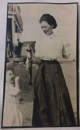 Vintage Old 1910 Photo Excited Little Girl Looking As Woman Holds Fish Caught