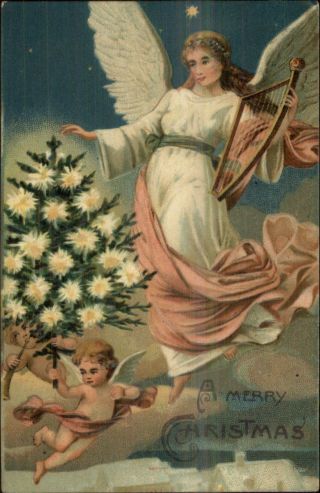 Christmas Angel W/ Harp Cherubs W/ Lit Tree C1910 Embossed Postcard
