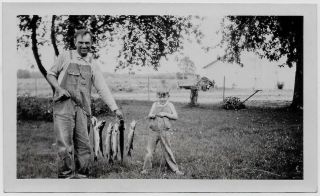Old Photo Man And Boy Holding Up Fish They Caught Wearing Overalls 1920s