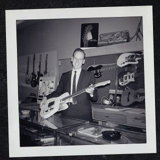Vintage Antique Photograph Man Holding Guitar In Music Store Musical Instuments