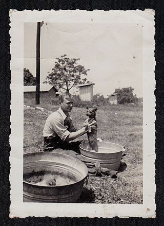 Vintage Antique Photograph Man Giving Puppy Dog Bath In Tub In Yard