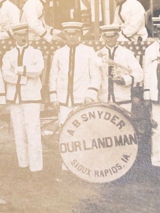 1909 RPPC OUR LAND MAN,  SIOUX RAPIDS IA.  BAND MEMBERS 2