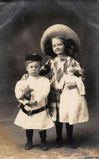 Boy With His Teddy Bear & Girl With Her Doll Posing,  Real Photo Pc Dated 1911