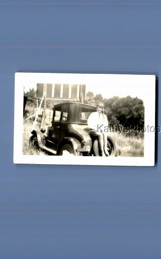 Found Vintage Photo D_7726 Pretty Woman Sitting On Back Of Old Car