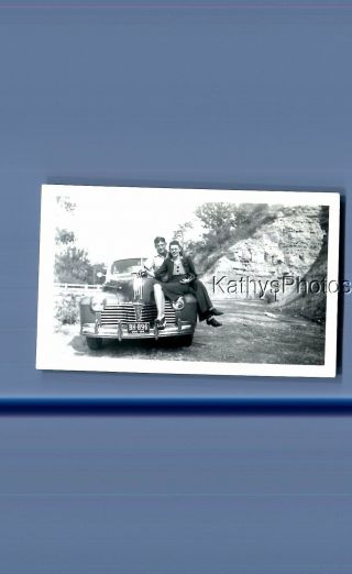 Found Vintage Photo D_6703 Man And Pretty Woman Sitting On Old Car
