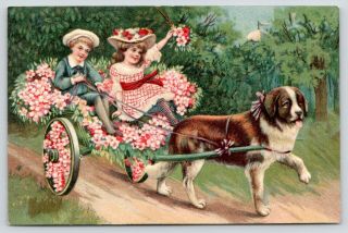 St Bernard Dog Pulls Victorian Boy & Girl In Flower Cart Embossed Germany 1910