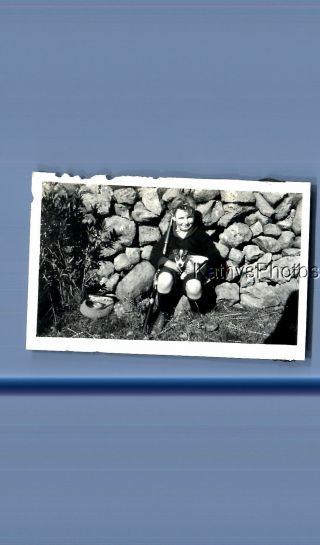 Found Vintage Photo D_6683 Boy Sitting On Stone Wall Holding Dog And Rifle