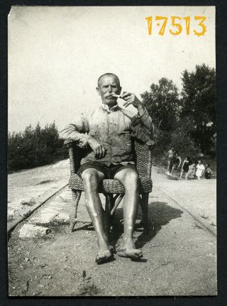 Funny Man W Pipe Sits Between Rail Lanes,  Unusual 1920’s Hungary,  Vintage Photog