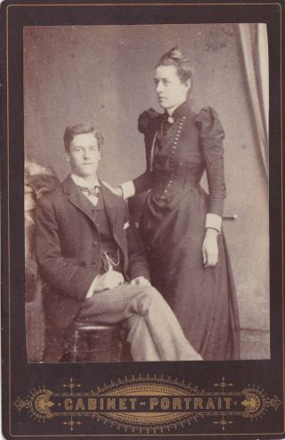 Antique Cabinet Photo - Smart Young Couple.  Lady With Small Waist.  No Studio
