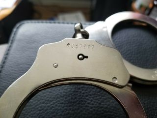 22 yr.  old Mod.  3 Peerless Handcuffs w/working key Serial 055995 & Sidekick Case 2