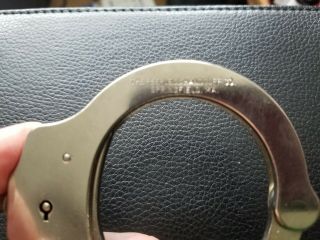 22 yr.  old Mod.  3 Peerless Handcuffs w/working key Serial 055995 & Sidekick Case 6