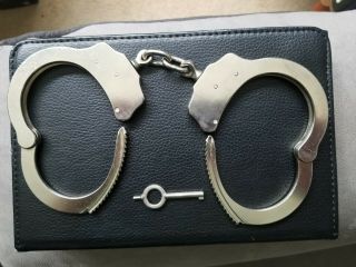 22 yr.  old Mod.  3 Peerless Handcuffs w/working key Serial 055995 & Sidekick Case 7