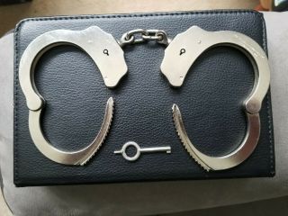 22 yr.  old Mod.  3 Peerless Handcuffs w/working key Serial 055995 & Sidekick Case 8
