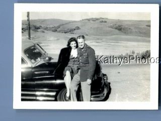 Found Vintage Photo C,  3731 Man Posed By Pretty Woman Sitting On Car Hood