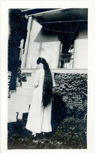 Vintage B/w Photo Of A Women With Long Hair And A Black Cat At Her Feet