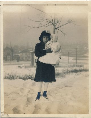 C1920 - 1929 Vintage Photo Of Girl In Snow With Big Doll