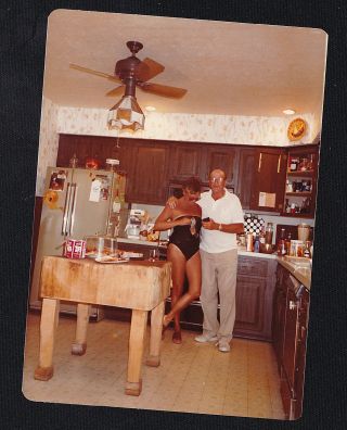 Old Vintage Photograph Man With Sexy Woman In Bathing Suit In Retro Kitchen