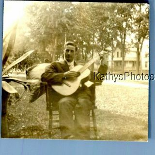 Found Vintage Photo C,  1763 Man Sitting In Chair Playing Guitar